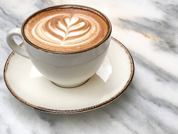 istock side view coffee with latte art on marble table in cafe 2240280114
