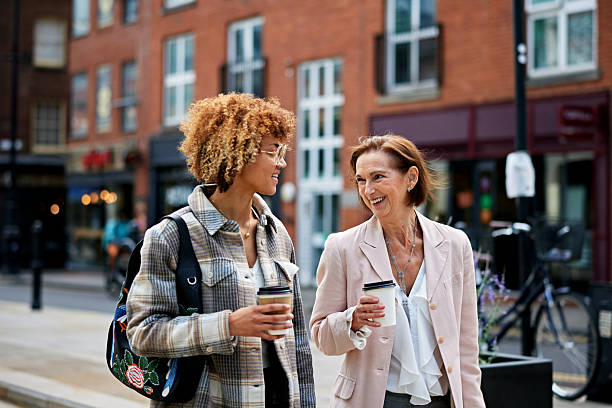 istock Business mentor and new hire enjoying coffee break together 2240280458