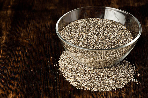 istock Glass bowl with chia seeds on wooden table 2240286305