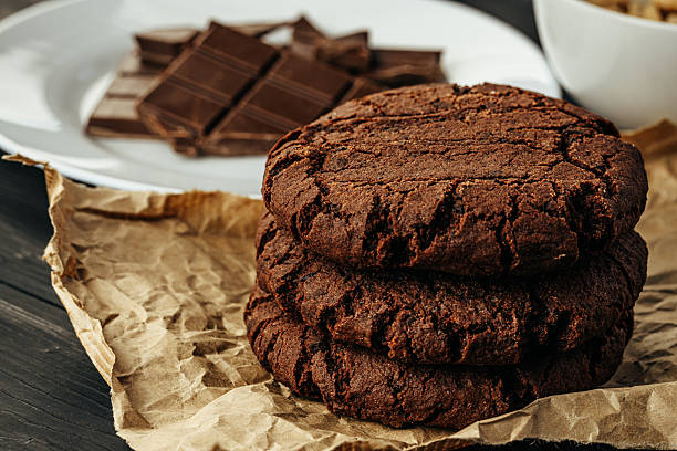 istock Chocolate cookies on dark table close up 2240287726