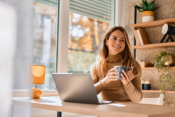 istock Woman freelancer relaxing at home office during autumn 2240292919