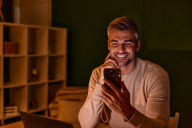 istock Happy man having a video call at home 2240294736