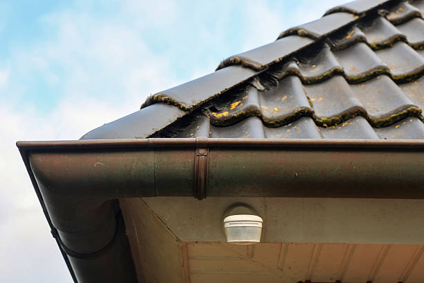 istock Motion detector installing under house roof protecting property 2240294943