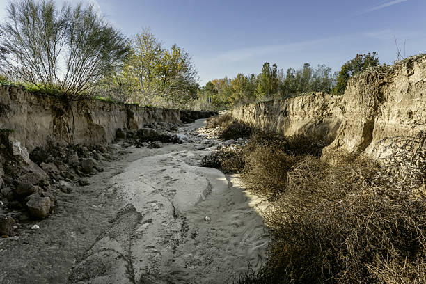 dry stream basin with sand in the bed