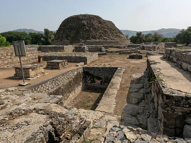 istock Dharmarajika complex view of small stupas beside sacred pond with main great stupa reflecting buddhist devotion in taxila pakistan 2240298882