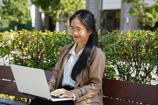 istock Freelance woman enjoying remote work outdoors 2240302972