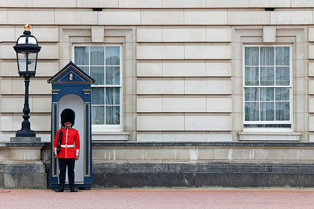 London, UK - June, 9th 2012: British Coldstream and Grenadier Guards in traditional red uniforms with bearskin hats - formed in ranks on parade in central London near Buckingham Palace