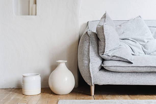 istock Boho living room interior with cozy sofa and natural shelves 2240308576