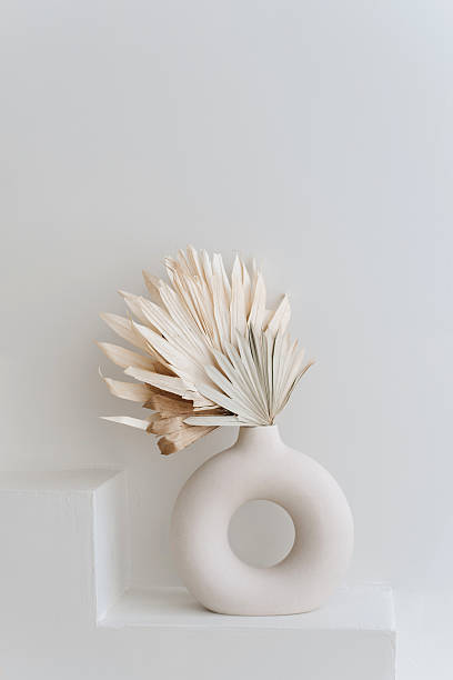 istock Modern half circle vase with dried flowers in boho home interior 2240308590