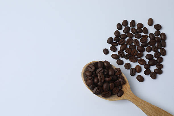 istock Many roasted coffee beans on the table, top view beans on the table 2240309441