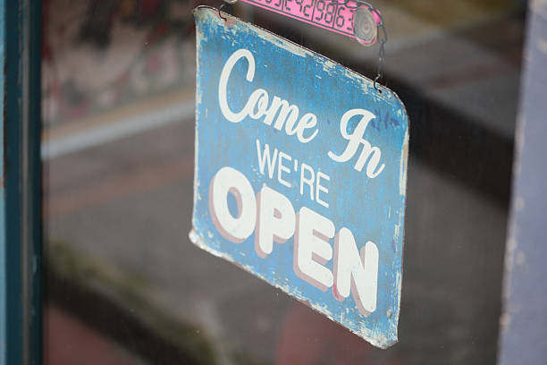 istock Vintage open sign inviting customers inside a shop 2240309535