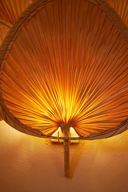 istock Soft glow radiating from unique artisanal light fixture 2240309620
