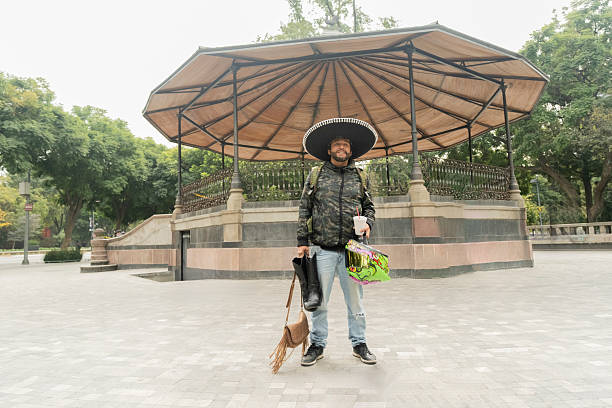 Mexican man wearing a traditional charro hat and typical ranch boots