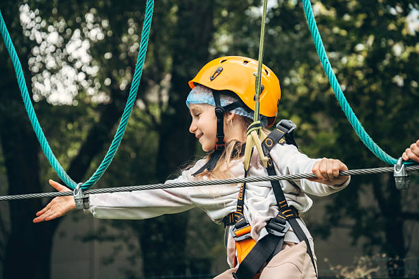 istock Child on Zip Line Adventure in Forest Setting 2240315861