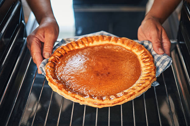 istock Preparing Pumpkin Pie for the Holidays in Domestic Kitchen 2240320214