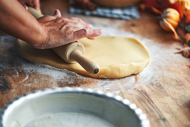 Preparing Pumpkin Pie for the Holidays in Domestic Kitchen