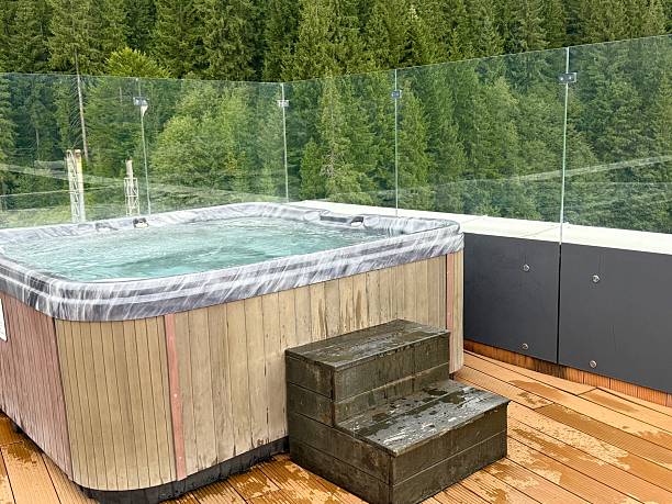 istock Hot tub on wooden deck with forest views 2240324728