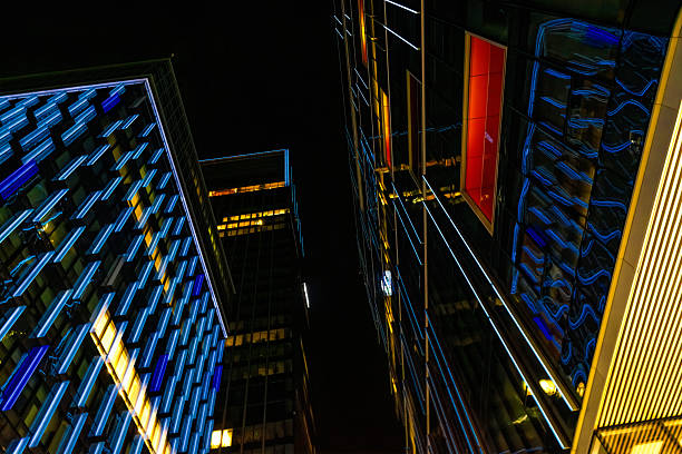 istock Windows in the modern office building at night. Business concept 2240326780