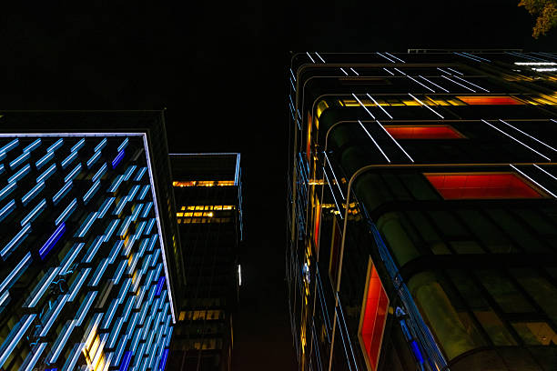 istock Windows in the modern office building at night. Business concept 2240326781