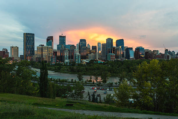 istock City Skyline at Sunset Over River Park With Greenery and Modern Buildings 2240328107
