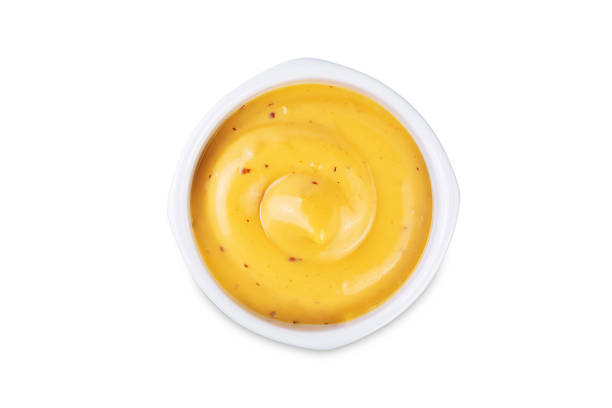 istock Mustard sauce in a bowl on a white isolated background 2240328950