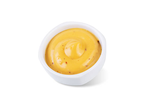 istock Mustard sauce in a bowl on a white isolated background 2240328955