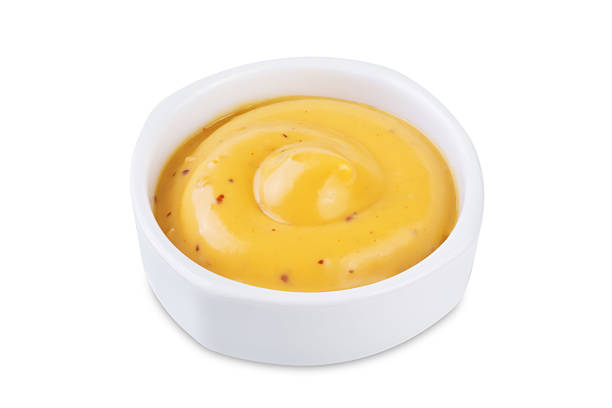 istock Mustard sauce in a bowl on a white isolated background 2240328956