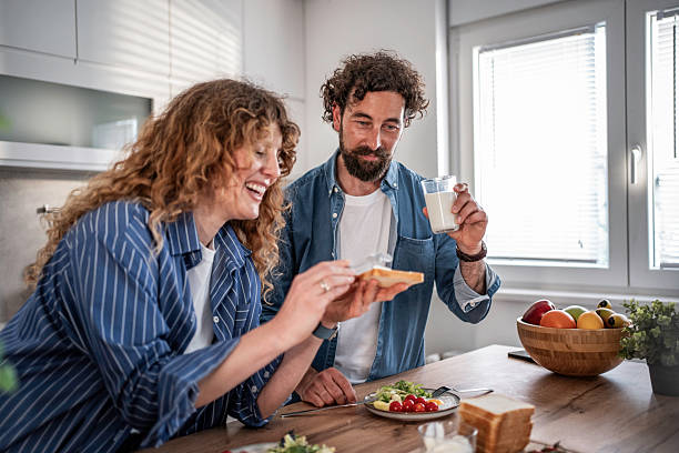 istock Happy couple enjoying a healthy breakfast in kitchen 2240335402