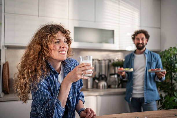 istock Happy couple enjoying healthy breakfast in kitchen 2240335429