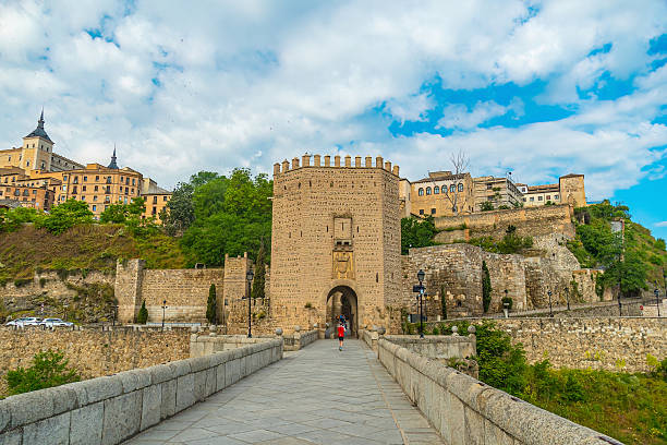 Alcazar and Alcantara Bridge, an arch bridge in Toledo, Spain