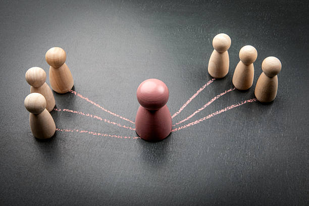 istock Leadership and communication strategy with central figure and team interaction lines 2240343724