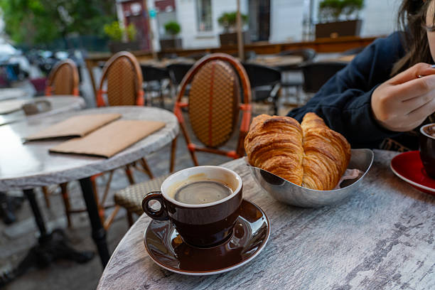 istock Coffee and croissants at a Parisian cafe. 2240360173