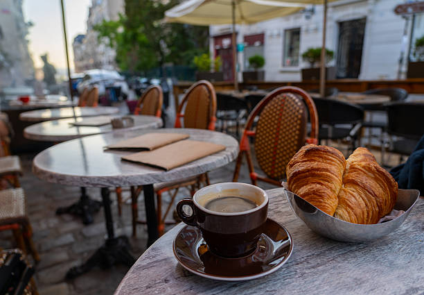 istock Coffee and croissants at a Parisian cafe. 2240360185