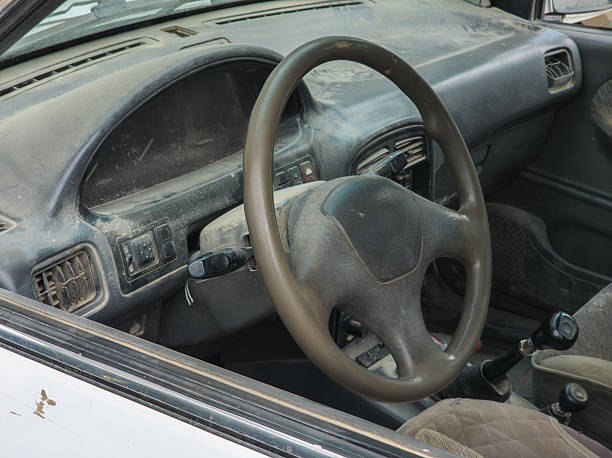 istock Dusty car interior with neglected dashboard and steering wheel 2240360561