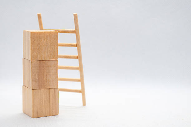 istock Wooden cubes with wooden ladder with customizable space for text. 2240363972