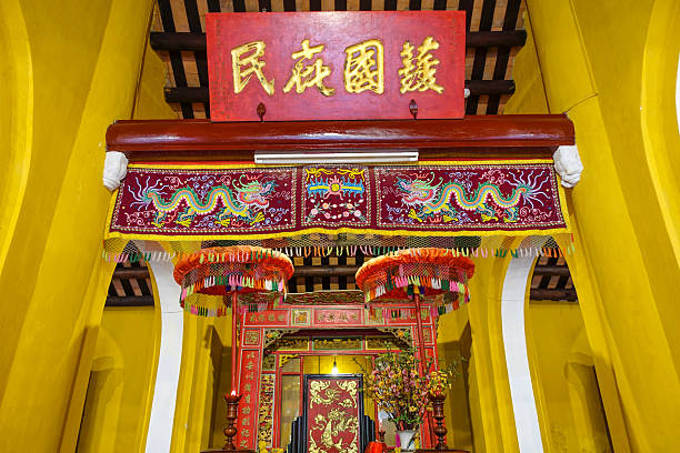 Interior inside an ancient Asian Buddhist temple on Hoi Quan Phuoc Kien pagoda in the old town in Hoi An in Asia. Hoi An, Vietnam - September 12, 2024