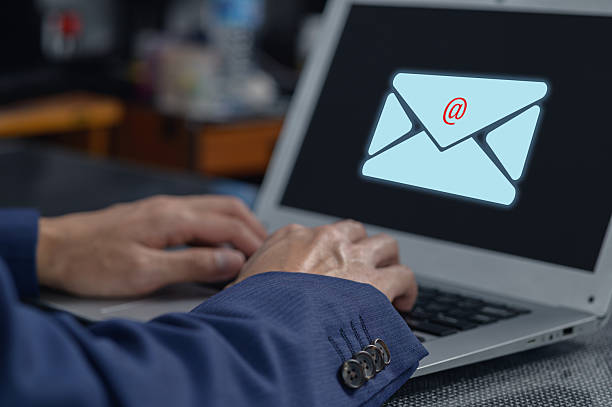 istock Hands Typing on Laptop with Email Icon and Notification Symbol 2240367087