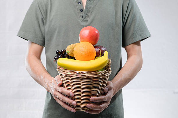 istock Fresh Fruit Display in Woven Basket Against Neutral Background 2240367167