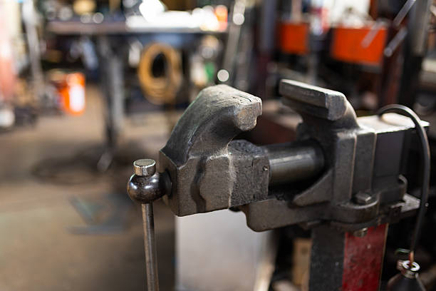 Large vise grip in a Japanese steel workshop close up.