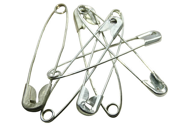 istock Group of safety pins isolated on white 2240374776