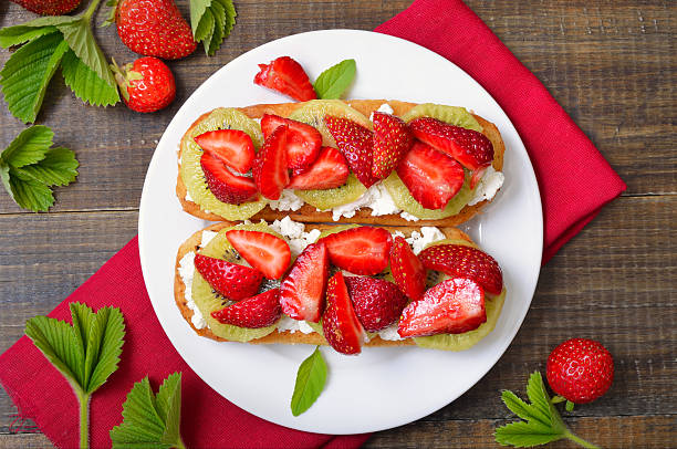 istock Strawberry bruschetta with kiwi and cream cheese 2240375388