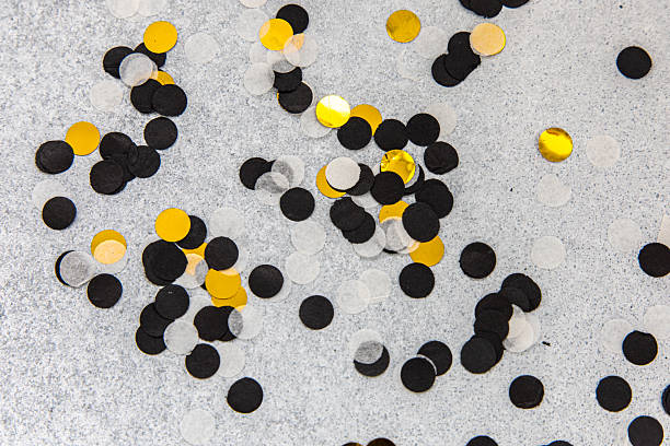 istock Colorful confetti scattered on a gray surface for a celebration or party event 2240383649