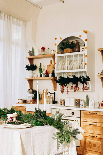 istock Cozy holiday kitchen scene with festive decorations and a dinner table set for celebration 2240383702