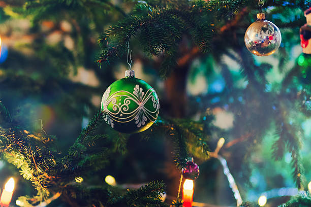 electric candles illuminating traditional german christmas tree