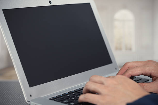 istock Hands Typing on a Laptop with Blank Screen in Minimalist Space 2240384609