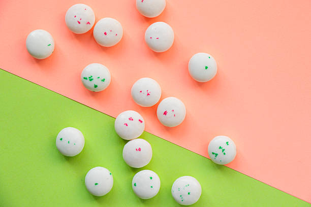 Candy on the pink and green background, gum