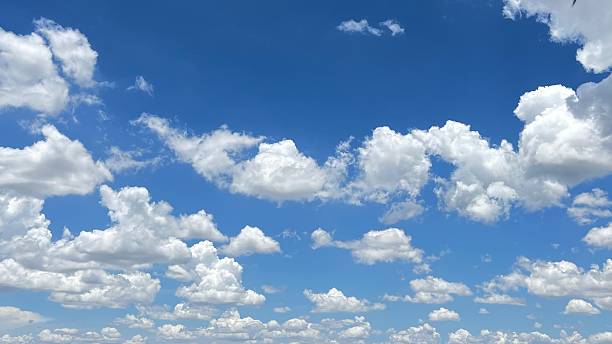 istock White cumulus clouds against blue sky, cloudscape in the sky 2240393617