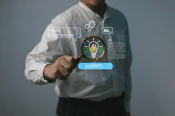 istock Businessman holding magnifying glass using AI agents assistant technology concept, representing artificial intelligence chatbot automation, machine learning data analysis digital transformation 2026 2240397170
