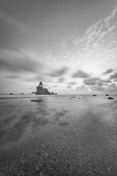 landscape sunset beach rocks sand waves water