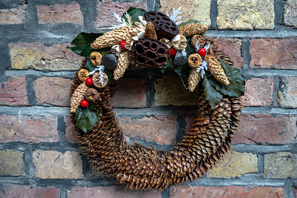istock Traditional Hungarian floral wreath on rustic brick wall 2240399064